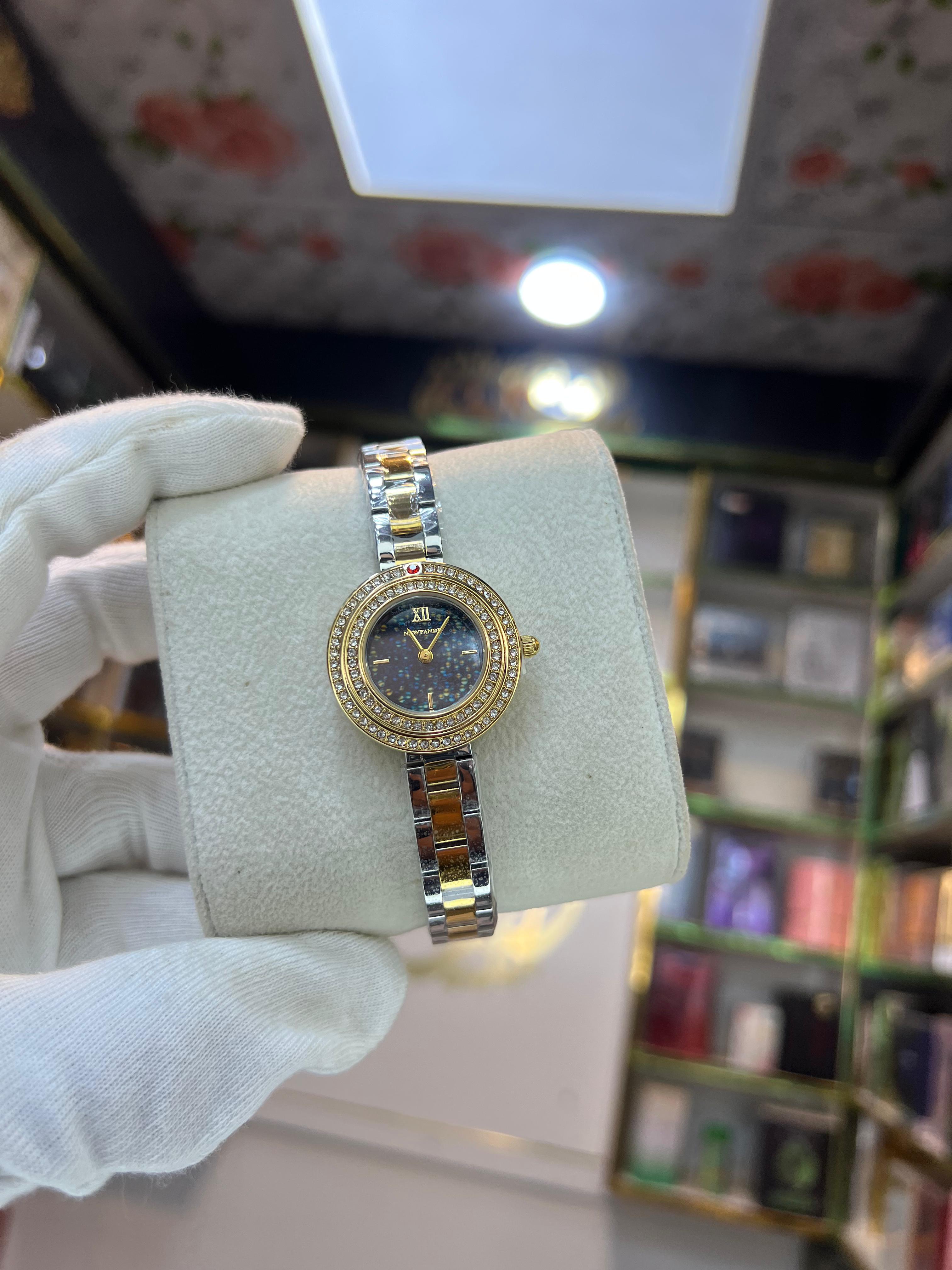 NEWFANDE Duo Celeste crystal bezel two-tone bracelet watch